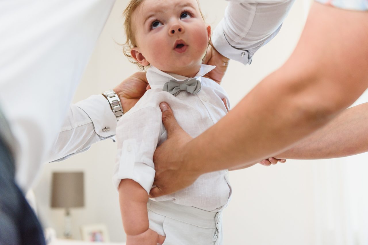 baby boy getting ready for his baptism at the church