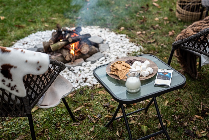 showing an Airbnb cottage experience: firepit with smores